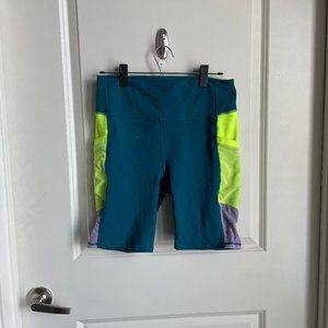 Fabletics Powerhold Neon Biker Shorts with Side Pockets